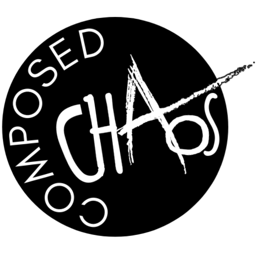 a logo - black circle with the words composed chaos inside